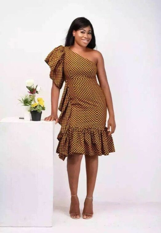 A fitted Ankara dress with a split hem