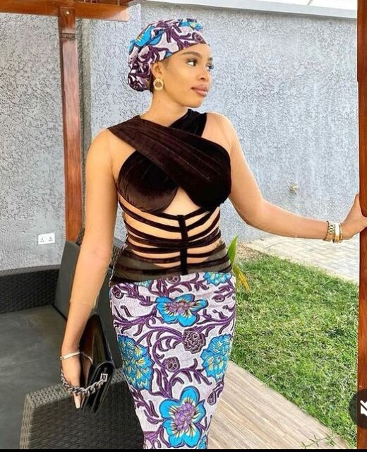 Woman in traditional African attire with modern twist.