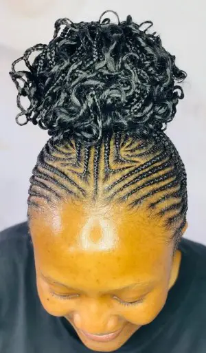 Sleek Cornrow Bun with Curly Ends